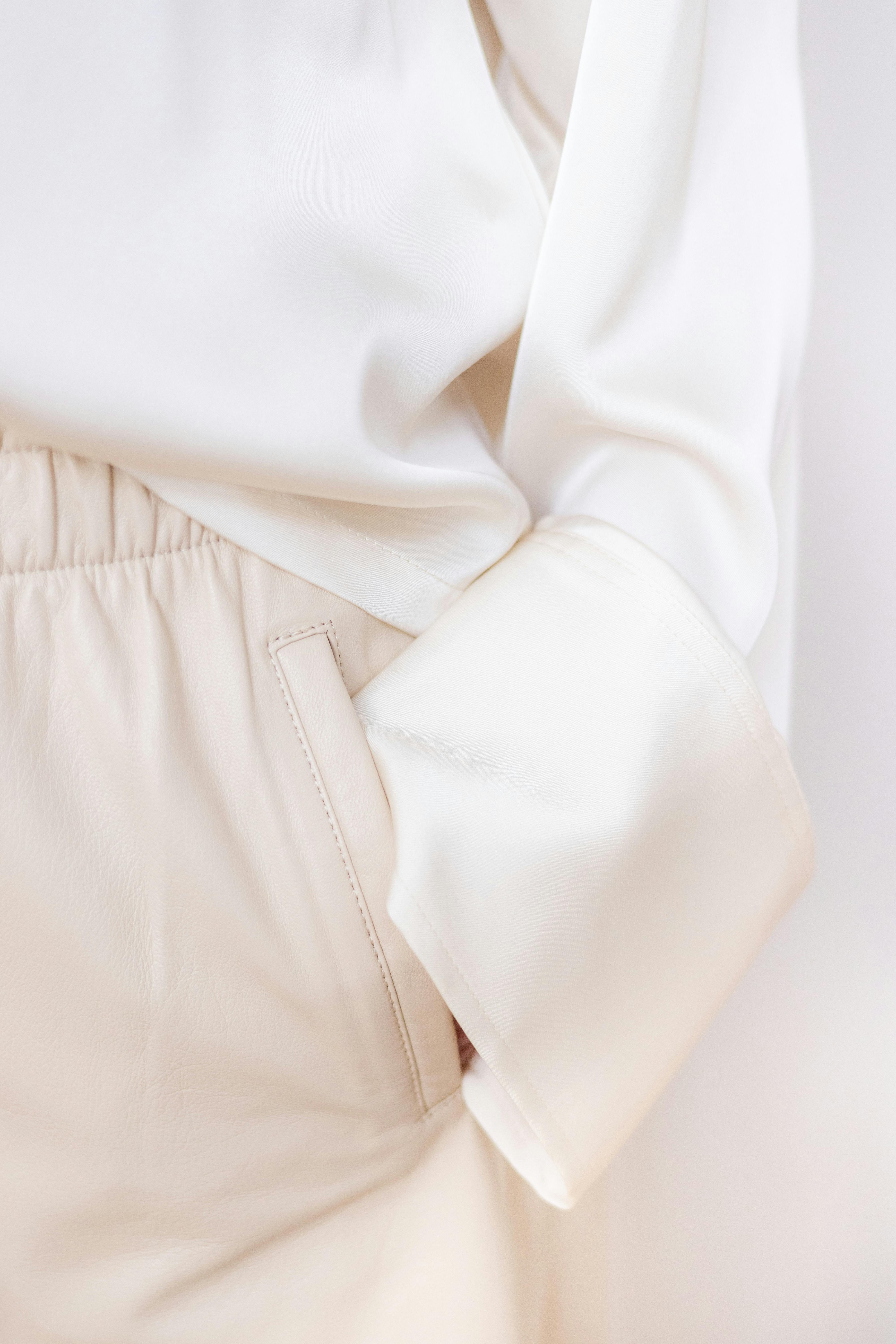Close-up of a beige garment with a white background